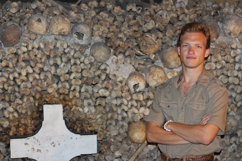 Ethan White in front of the Catacombs of Paris, where he researched for his UF Honors thesis on medieval France.