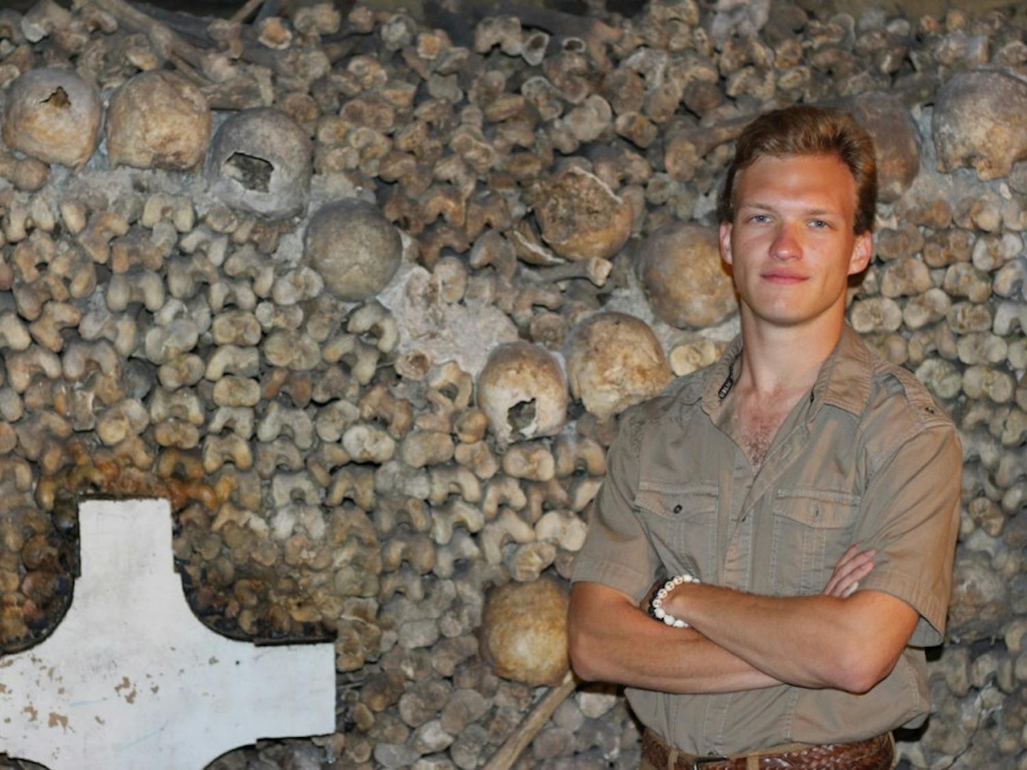 Ethan White in front of the Catacombs of Paris, where he researched for his UF Honors thesis on medieval France.