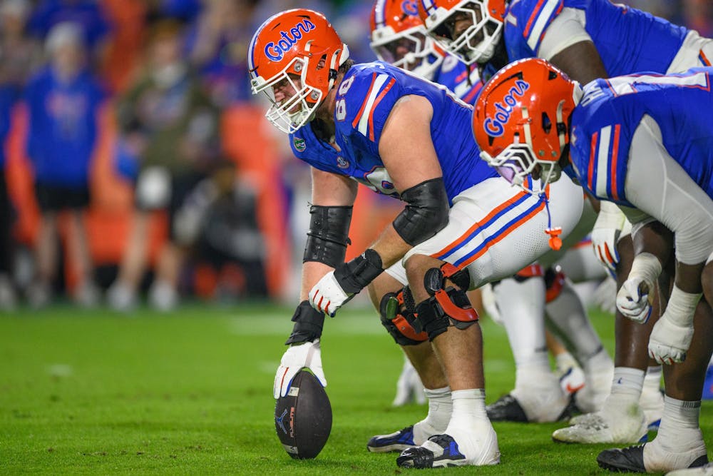 Florida offensive lineman Jake Slaughter (66) prepares to snap the ball during the second half of an NCAA college football game against Tennessee, Saturday, Nov. 22, 2025, in Gainesville, Fla.