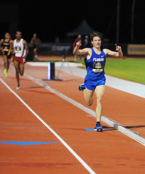 Jimmy Clark celebrates winning the men’s 10,000-meter at the SEC Outdoor Championships in Columbia, Mo., on May 10. Clark was named SEC Men’s Freshman Runner of the Year on Friday.
