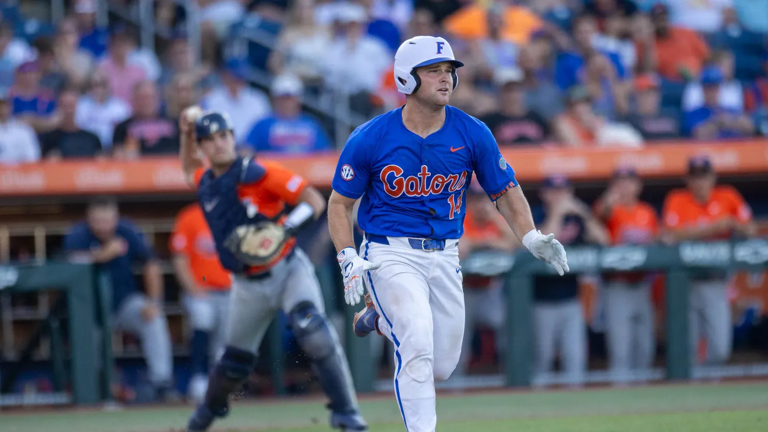 Florida catcher Karson Bowen (14) runs to first base in an attempt to beat the catcher during an NCAA college baseball game against Auburn at Condron Family Ballpark in Gainesville, Fla., Friday, April 17, 2026.