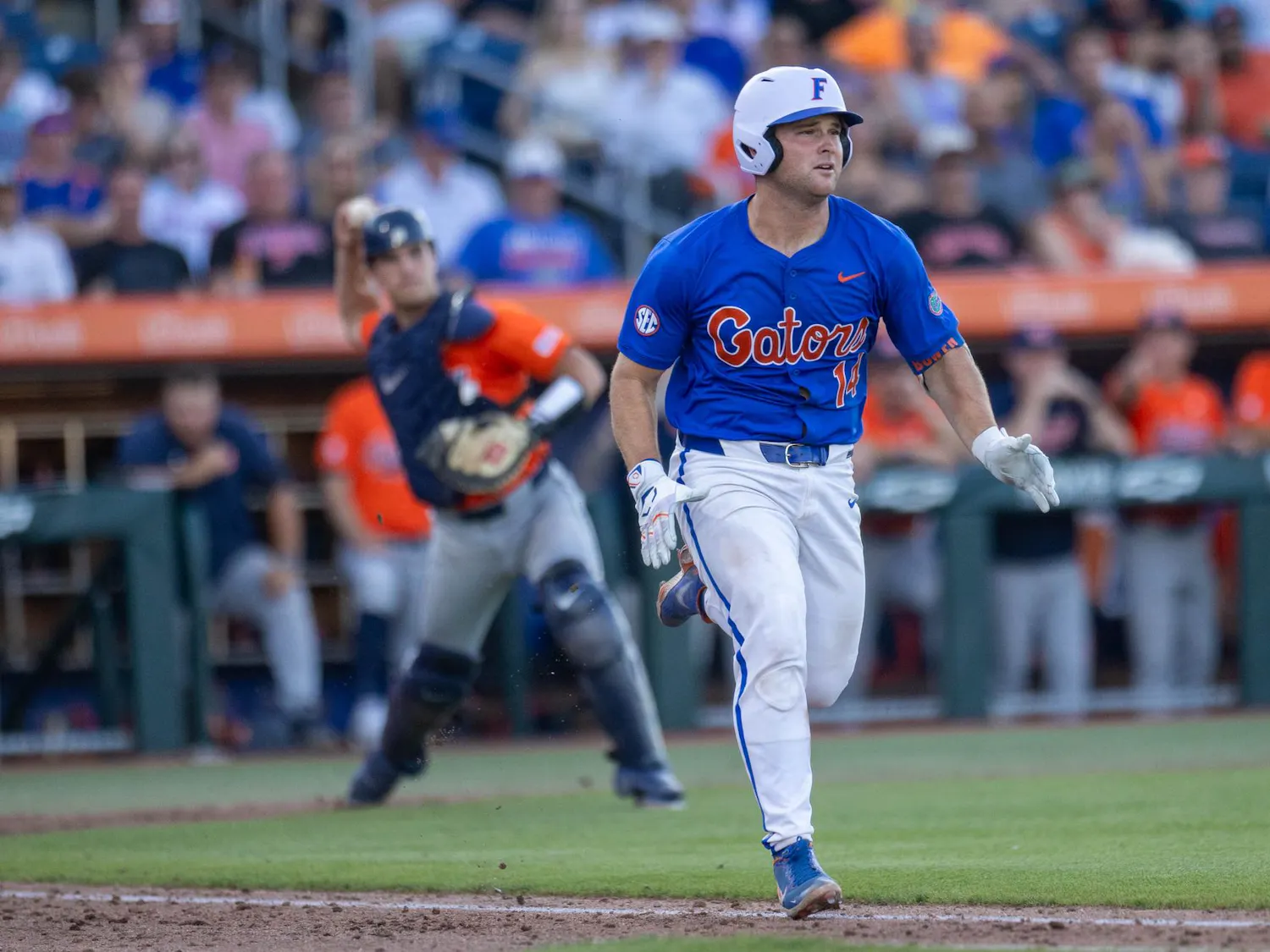 Florida catcher Karson Bowen (14) runs to first base in an attempt to beat the catcher during an NCAA college baseball game against Auburn at Condron Family Ballpark in Gainesville, Fla., Friday, April 17, 2026.