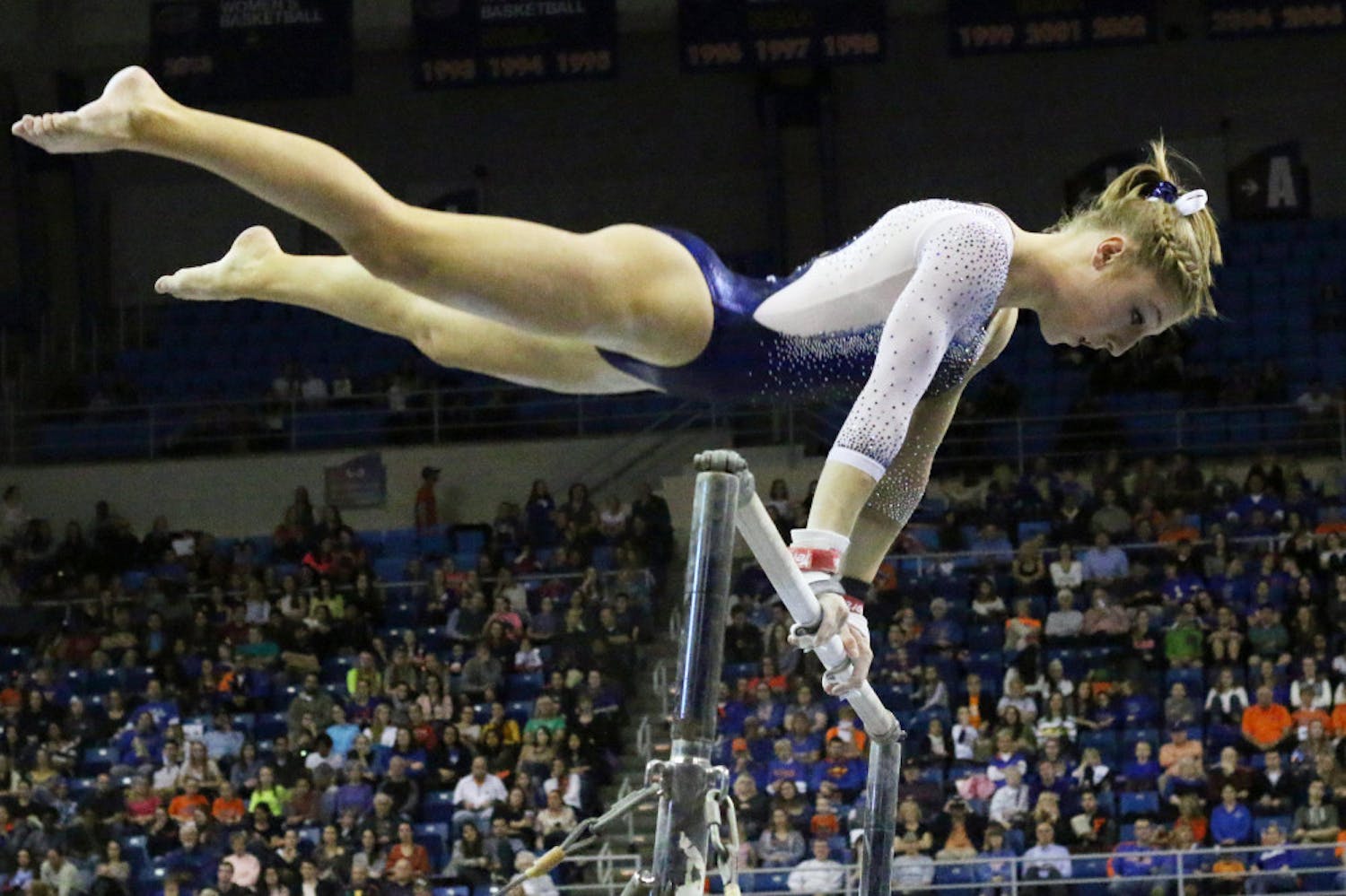 Freshman Alex McMurtry competes on the uneven parallel bars during Florida's win against Auburn on Friday in the O'Connell Center.
