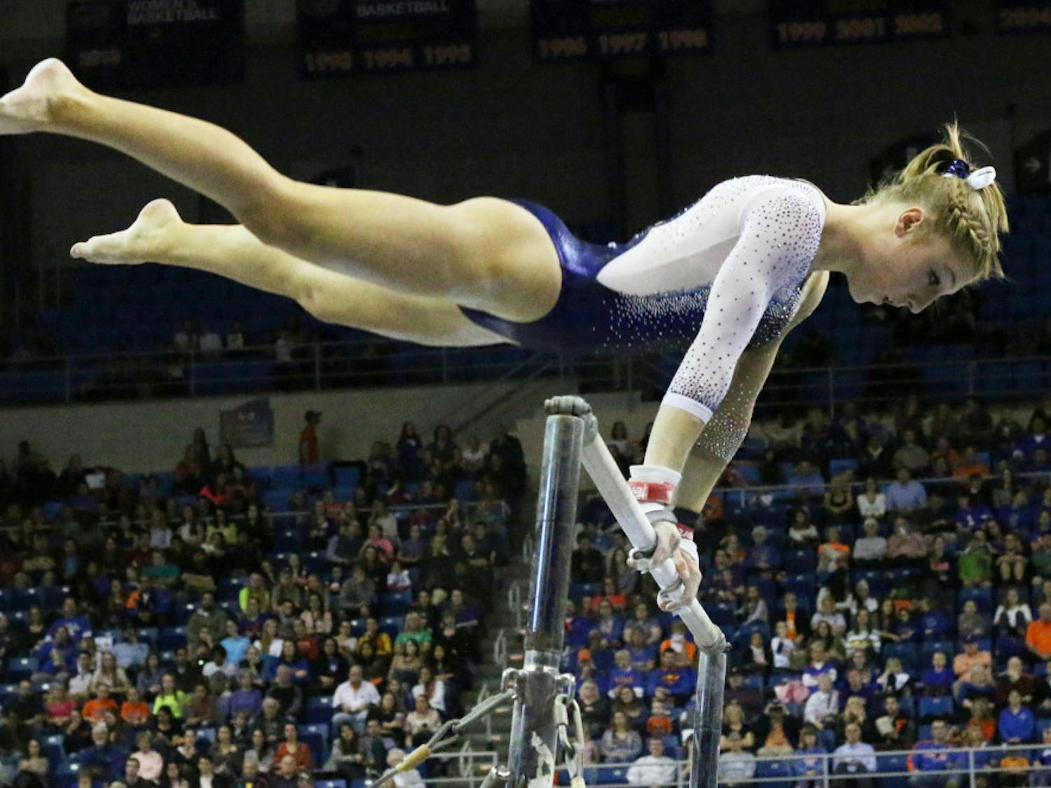 Freshman Alex McMurtry competes on the uneven parallel bars during Florida's win against Auburn on Friday in the O'Connell Center.