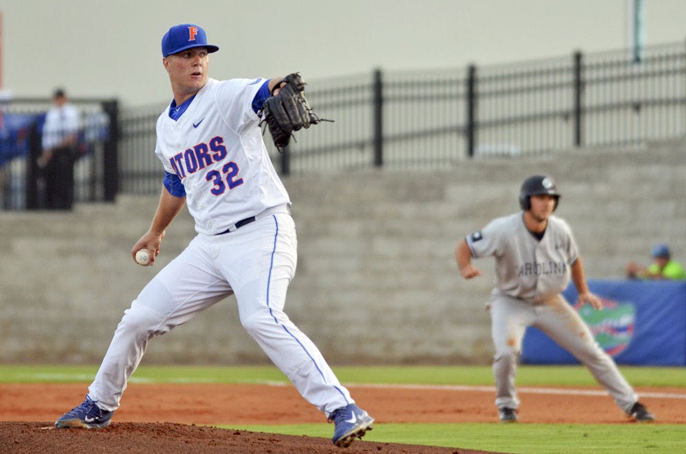 <p>UF's Logan Shore pitches during Florida's 14-3 win against South Carolina on April 10, 2015 at McKethan Stadium. Shore pitched seven innings giving up two earned runs in a loss to Auburn on Thursday night.&nbsp;</p>