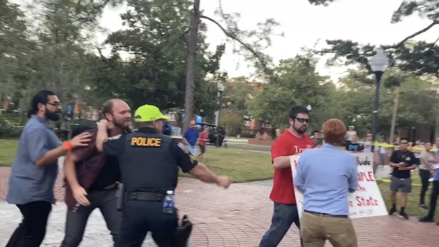 Brian Patrick Smith was outside University Auditorium Thursday night among among protestors who were protesting against Donald Trump Jr. and Kimberly Guilfoyle's speech. Richard Tate was arrested after taking Smith's "Make America Great Again" cap. 