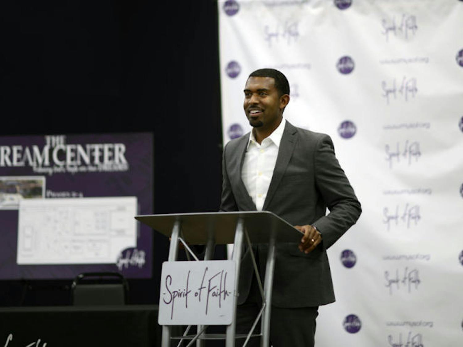 Spirit of Faith Pastor Kenneth Claytor speaks at the Spirit of Faith Dream Center on Thursday. The church raised $300,000 to buy the site formerly owned by the Rev. Terry Jones.