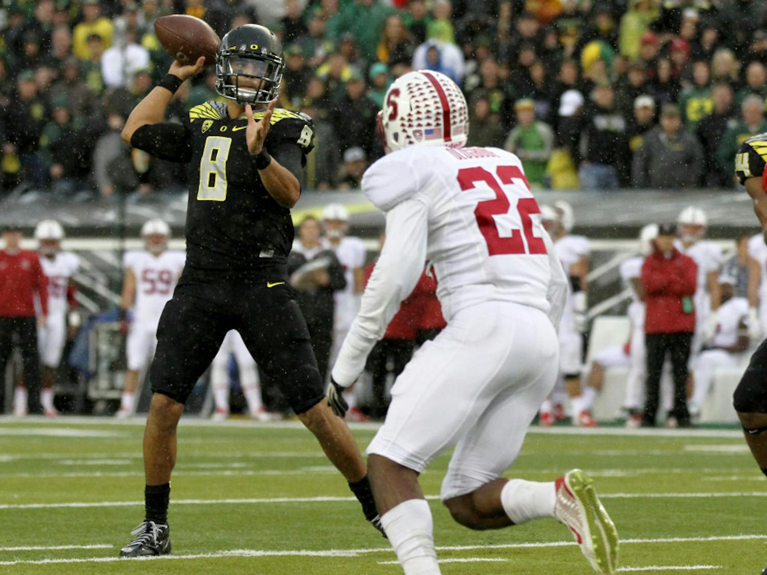 Oregon quarterback Marcus Mariota (8) looks to throw towards the end zone during the first quarter against Stanford in an NCAA college football game in Eugene, Ore., Saturday, Nov. 1, 2014.