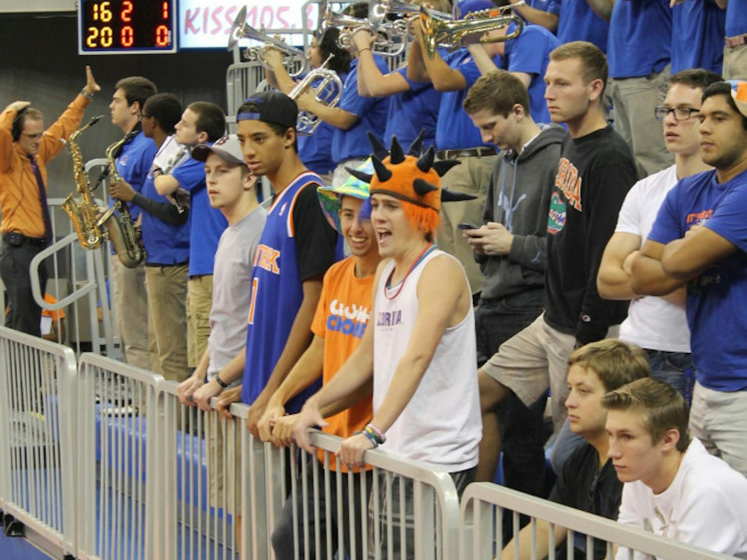 Members of "Tolbert 5" watch the Florida women's volleyball team during a home match this year in the O'Connell Center.