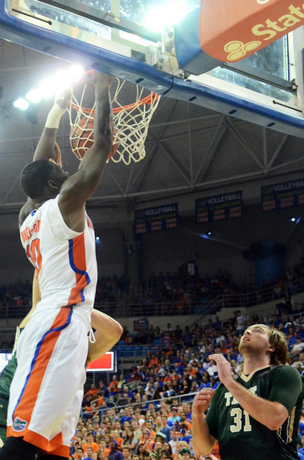 <p>Dorian Finney-Smith dunks during Florida's season-opening win against William &amp; Mary on Friday in the O'Connell Center.</p>