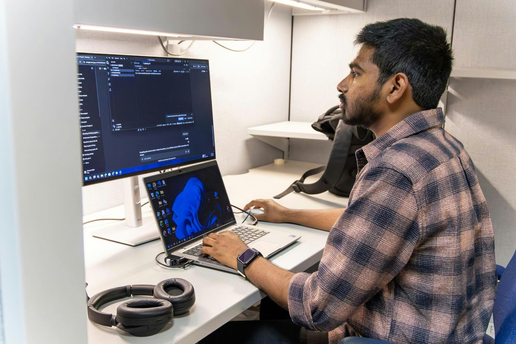 Sameer Shaik, an artificial intelligence analyst, looks at his computer in his cubicle in Gainesville, Fla., Friday, April 3, 2026. 