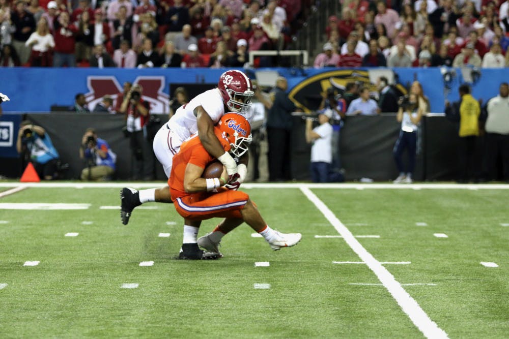 <p>UF quarterback Austin Appleby gets sacked by Alabama defensive lineman Jonathan Allen during Alabama's 54-16 win over Florida in the 2016 Southeastern Conference Championship Game. </p>