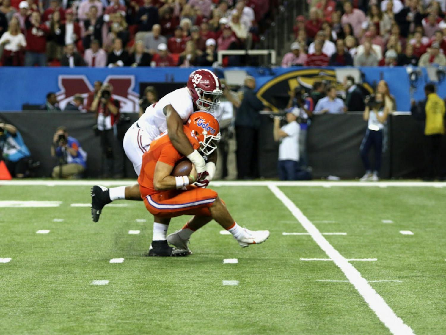 UF quarterback Austin Appleby gets sacked by Alabama defensive lineman Jonathan Allen during Alabama's 54-16 win over Florida in the 2016 Southeastern Conference Championship Game. 