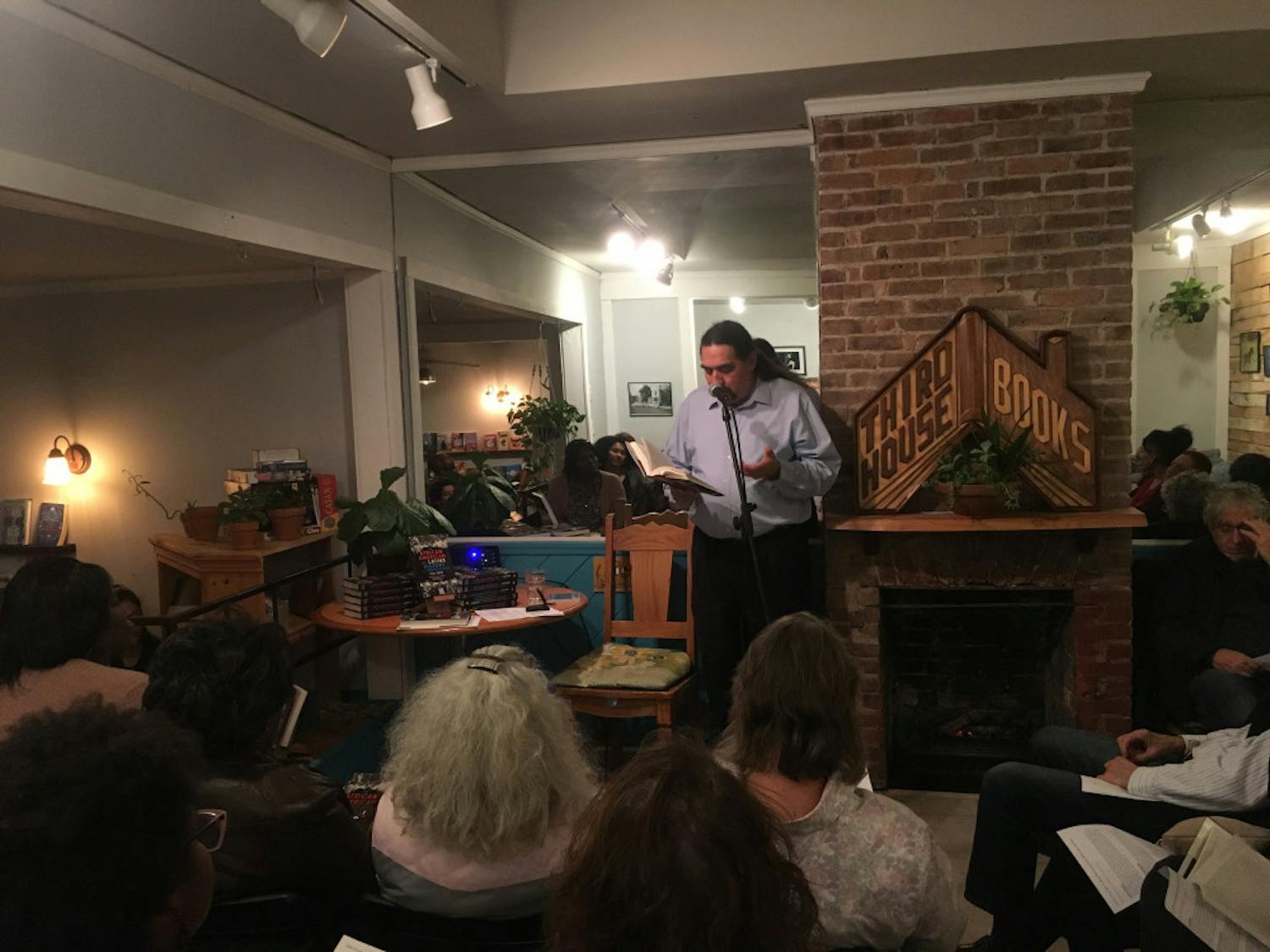 UF associate professor Paul Ortiz reads a few passages out of his new book to audience members at Third House Books &amp; Coffee. Ortiz’s book “An African American and Latinx History of the United States” was officially released on Tuesday.