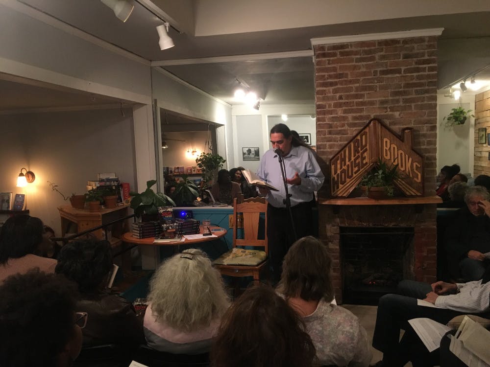 <p>UF associate professor Paul Ortiz reads a few passages out of his new book to audience members at Third House Books &amp; Coffee. Ortiz’s book “An African American and Latinx History of the United States” was officially released on Tuesday.</p>