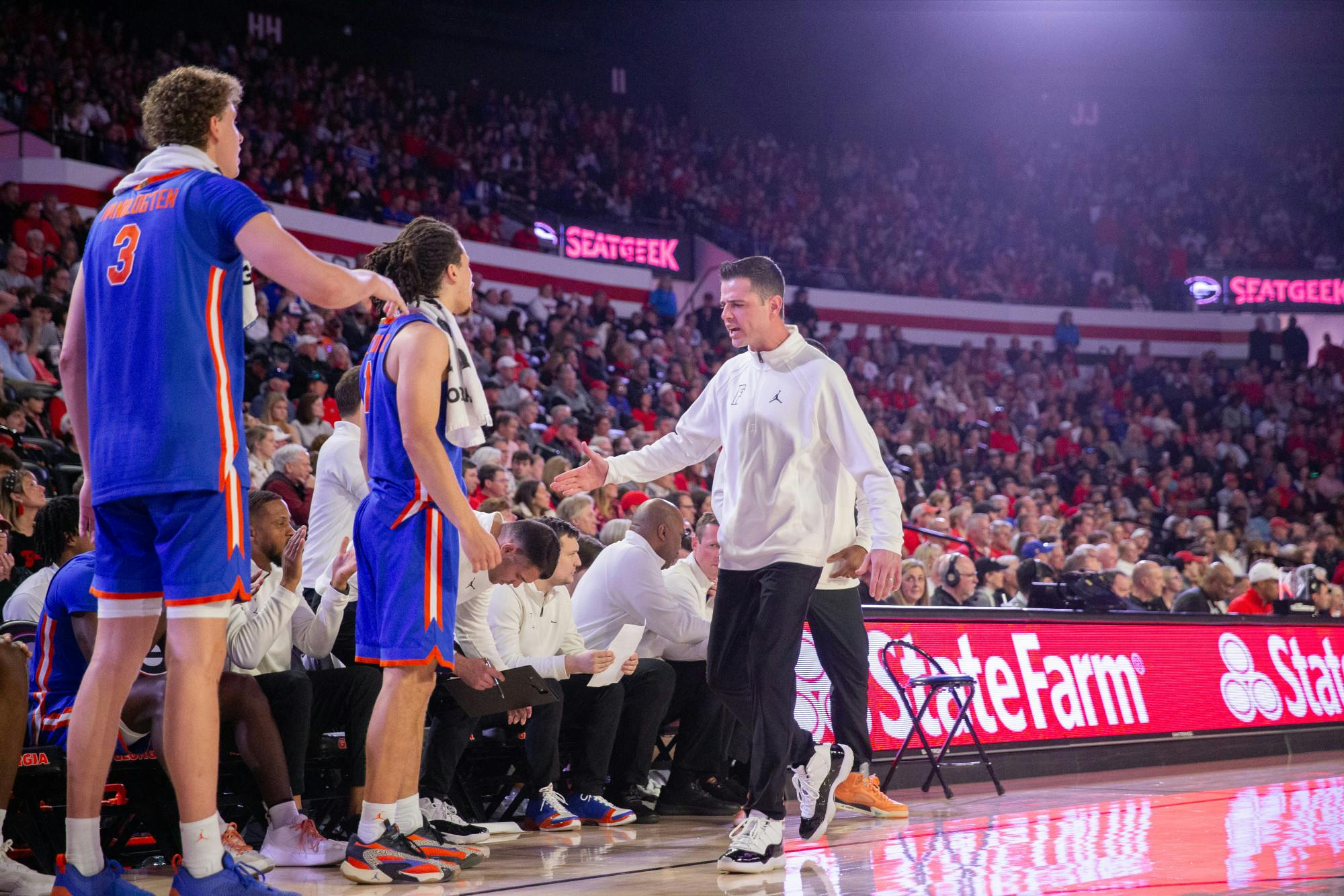 Florida men's basketball head coach Todd Golden shows emotion on the bench during the team's game at the University of Georgia on Saturday, February 17, 2024. 