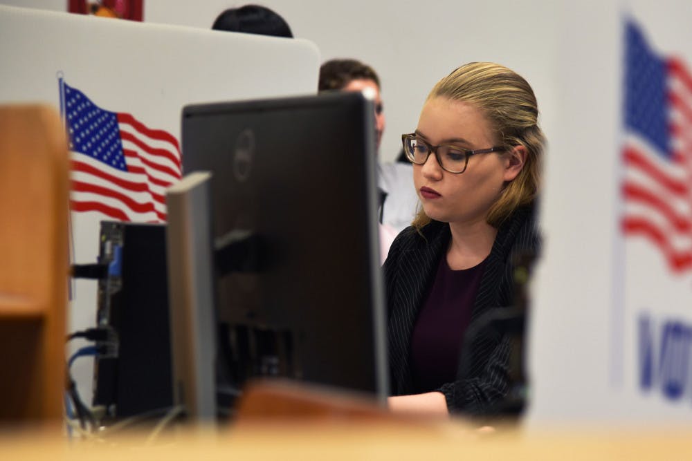 <p dir="ltr"><span>Olivia Dunbar, a 20-year-old computer engineering junior at UF, votes Tuesday in the fall student government election at the Marston Library.</span></p>