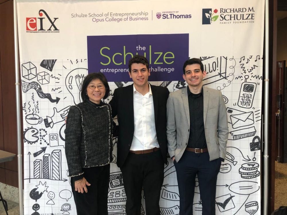 Executive Director of Outreach &amp; Incubation at UF Entrepreneurship and Innovation Center Nola Miyasaki (left), Brian De Souza (middle) and Pablo Garces (right) take a picture at e-Fest at the University of St.Thomas. Garces and De Souza, both 21-year-old UF computer science juniors,&nbsp;&nbsp;competed with 24 other finalists for up to $250,000 in prizes this weekend.&nbsp;