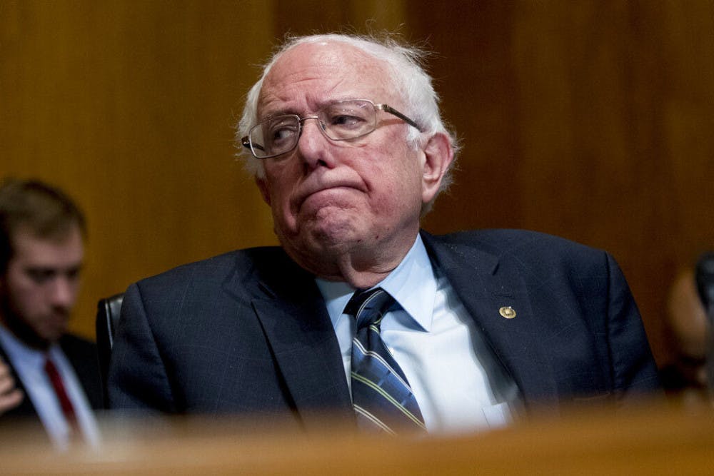 FILE - In this Jan. 16, 2019, photo, Sen. Bernie Sanders, I-Vt., reacts during a hearing on Capitol Hill in Washington. The growing Democratic presidential field is increasingly splitting into two camps: those who want to quickly overhaul economic systems that have existed for decades and those who favor more gradual change. (AP Photo/Andrew Harnik, File)