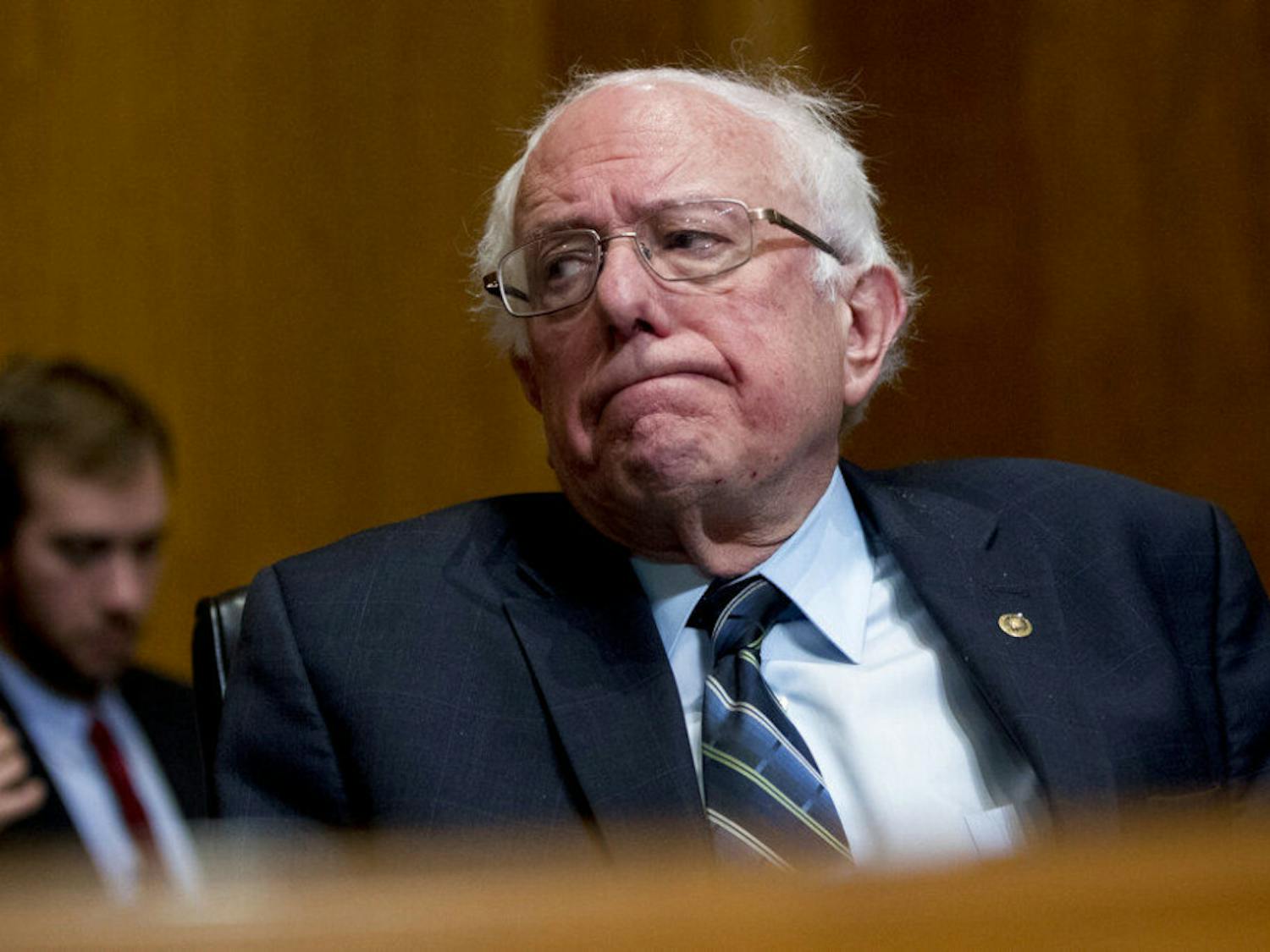 FILE - In this Jan. 16, 2019, photo, Sen. Bernie Sanders, I-Vt., reacts during a hearing on Capitol Hill in Washington. The growing Democratic presidential field is increasingly splitting into two camps: those who want to quickly overhaul economic systems that have existed for decades and those who favor more gradual change. (AP Photo/Andrew Harnik, File)