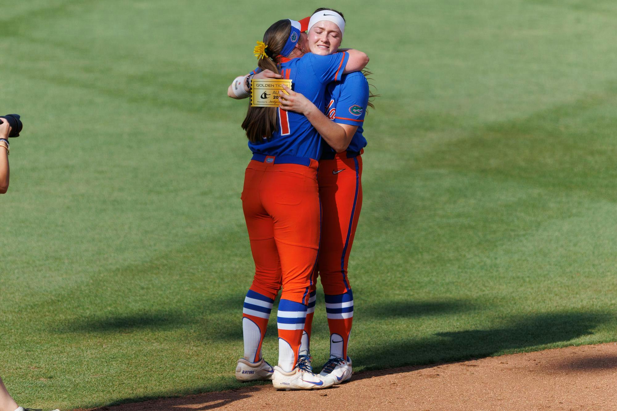 Florida infielder Kenleigh Cahalan (31) celebrates with catcher Jocelyn Erickson (8) after both were awarded Athletes Unlimited Softball League golden ticket s after an NCAA softball game against Auburn, Saturday, April 18, 2026, in Gainesville, Fla.
