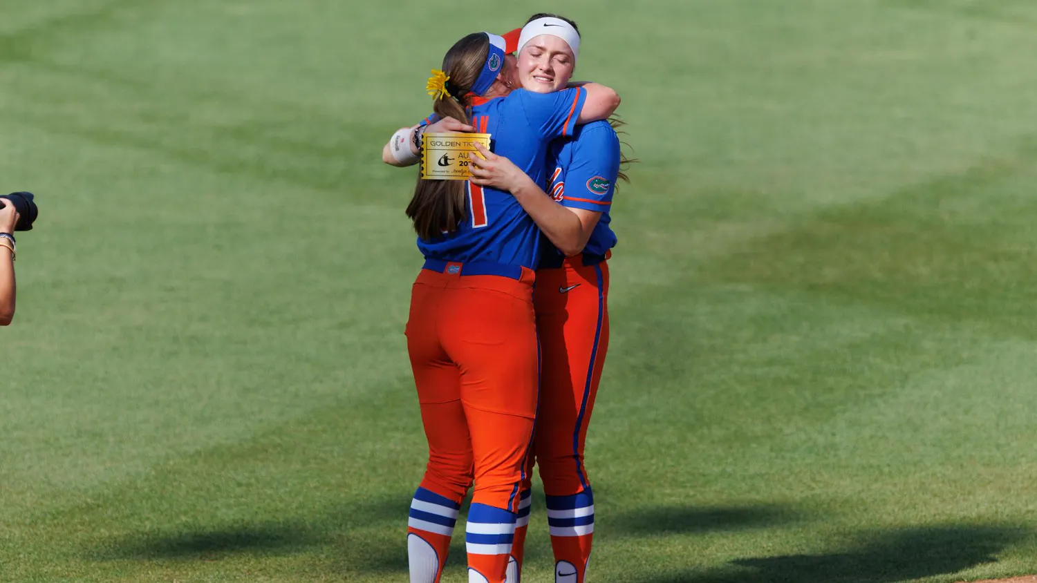 Florida infielder Kenleigh Cahalan (31) celebrates with catcher Jocelyn Erickson (8) after both were awarded Athletes Unlimited Softball League golden ticket s after an NCAA softball game against Auburn, Saturday, April 18, 2026, in Gainesville, Fla.