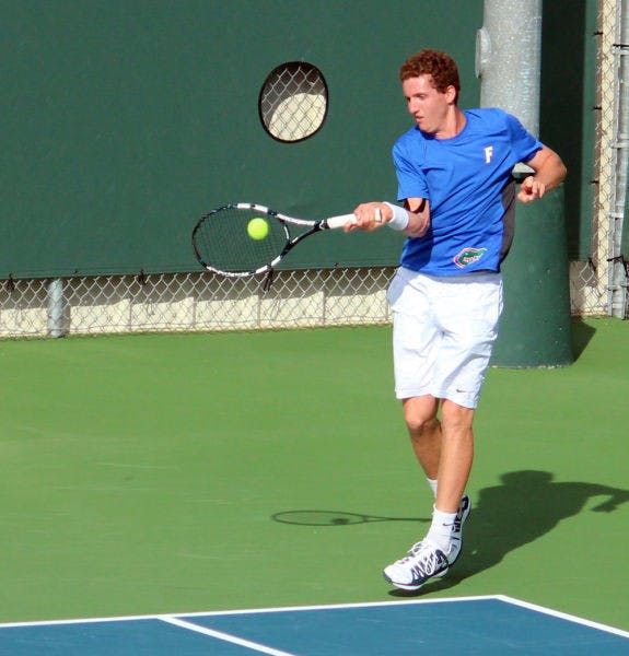 Maxx Lipman swings at the ball during Florida’s 4-2 win against TCU on Jan. 26 at the Ring Tennis Complex.