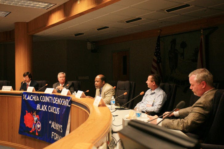 Candidates debated issues at the Alachua County Democratic Black Caucus forum Monday night at the County Administration Building.