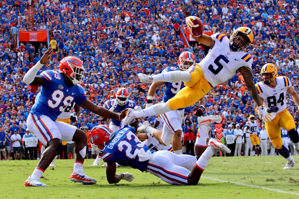 <p>Chauncey Gardner, Jr. tackles LSU running back Derrius Guice during Florida's 17-16 loss against the Tigers on Saturday at Ben Hill Griffin Stadium.</p>