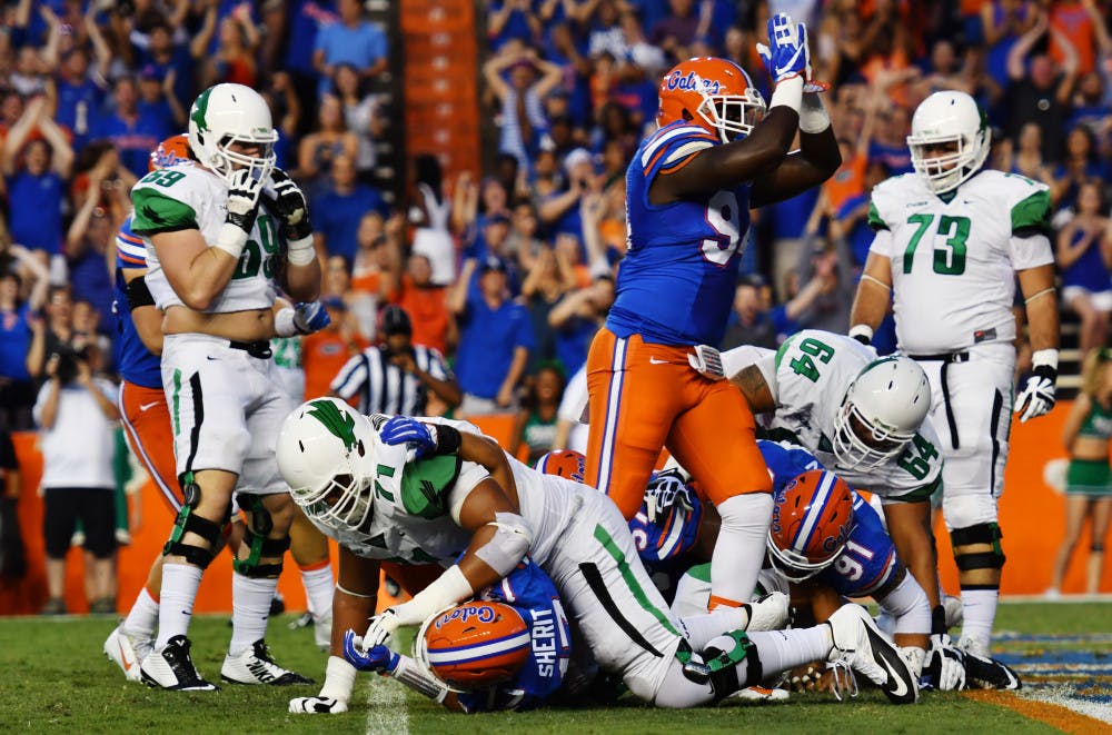 <p>Bryan Cox signals for a safety during Florida's 32-0 win over North Texas on Sept. 17, 2016, at Ben Hill Griffin Stadium.</p>
