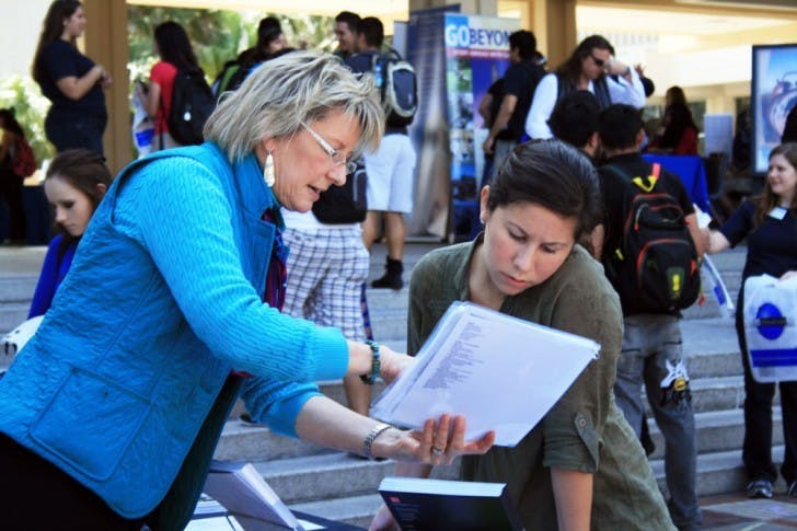 Andrea Walgren,&nbsp;Institutional Representative for Boston University, talks to Patricia Valladares, 19-year-old exploratory freshman,&nbsp;about the benefits of an internship abroad.