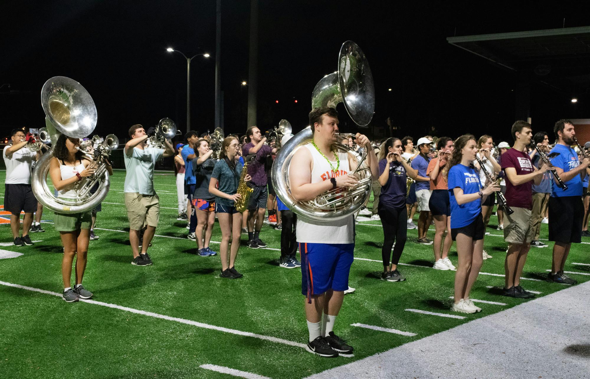 Tubas and drums of the Gator Marching Band move into position while practicing at Gator Band Field Sunday, March 5, 2023.