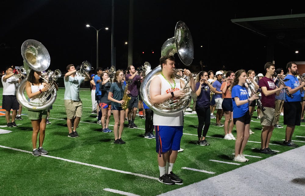 <p>Tubas and drums of the Gator Marching Band move into position while practicing at Gator Band Field Sunday, March 5, 2023.</p><p><br/><br/></p>