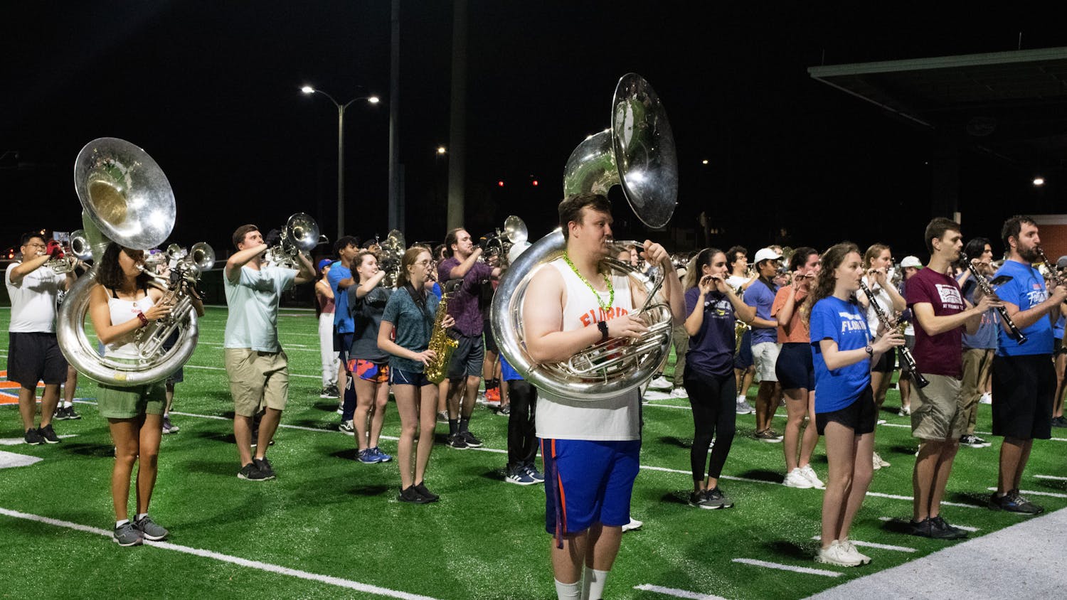 Tubas and drums of the Gator Marching Band move into position while practicing at Gator Band Field Sunday, March 5, 2023.