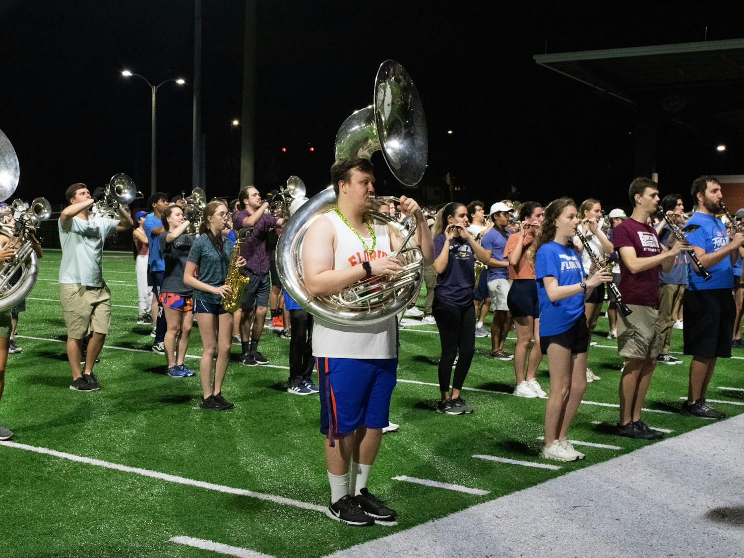 Tubas and drums of the Gator Marching Band move into position while practicing at Gator Band Field Sunday, March 5, 2023.