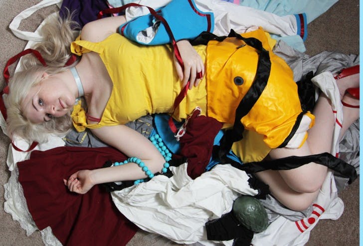 Devan Baird, a 21-year-old telecommunication senior, lies on her competition-winning cosplays, which are costumes based on television, anime and comic book characters.