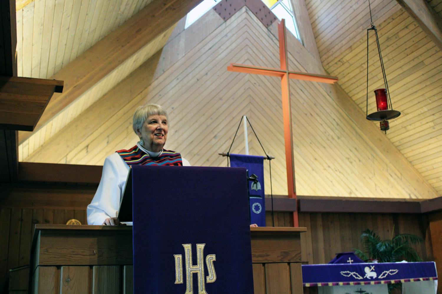 Pastor Lynn Fonfara, 75, stands at the podium at the front of the University Lutheran Church in Gainesville Sunday, March 19, 2023. “There&#x27;s always some personality things that have nothing to do with my being a man or a woman,” she said. “It&#x27;s just the nature of the congregation sometimes is a little funky...around 1990 I started seeing women as pastors. But that&#x27;s 20 years after women were first ordained in ELCA.” 