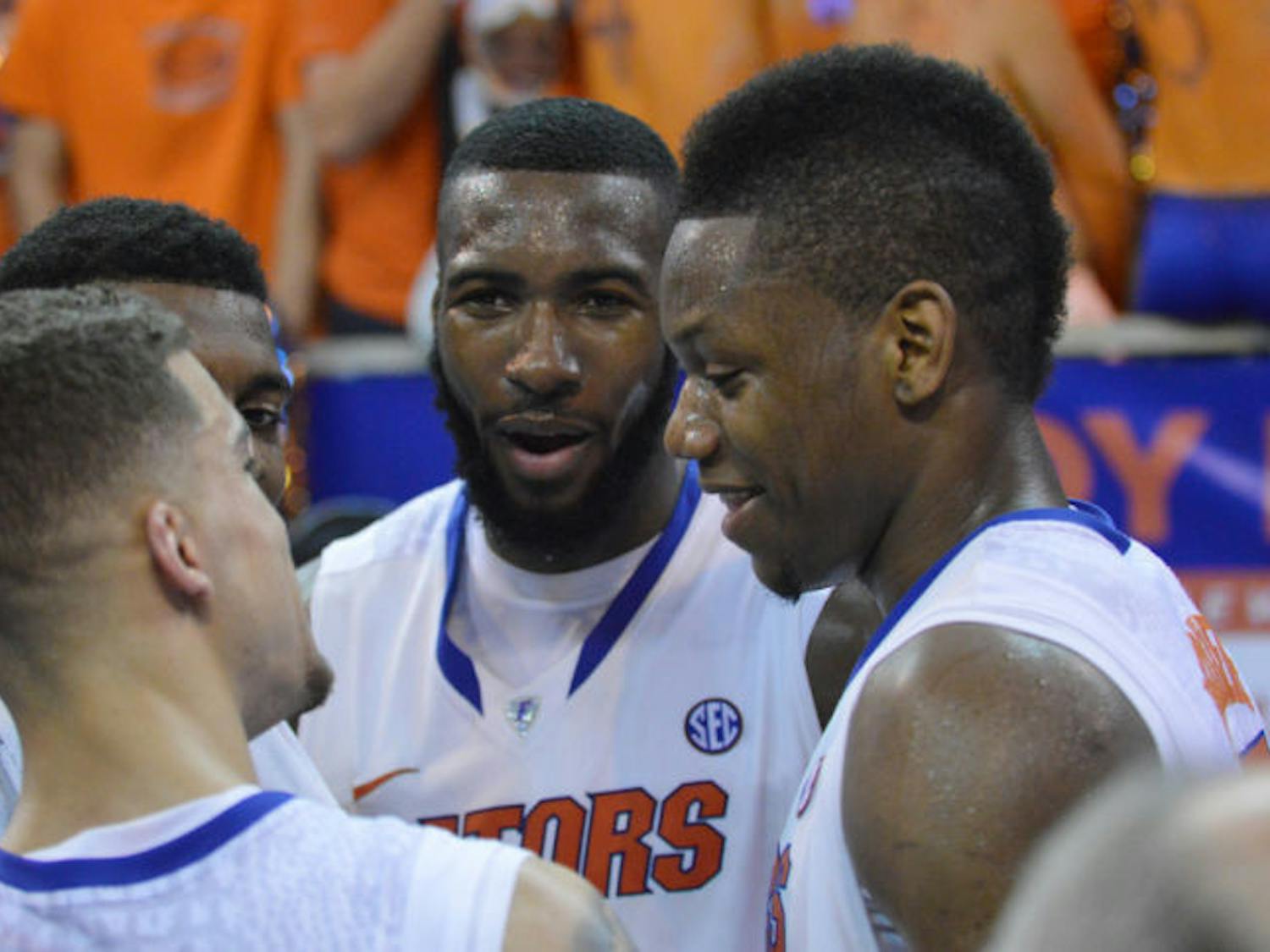 Scottie Wilbekin, Casey Prather, Patric Young and Will Yeguete huddle together after Florida’s 84-65 win against Kentucky on Saturday in the O’Connell Center. The Gators are the first team to finish their Southeastern Conference regular-season schedule 18-0.
