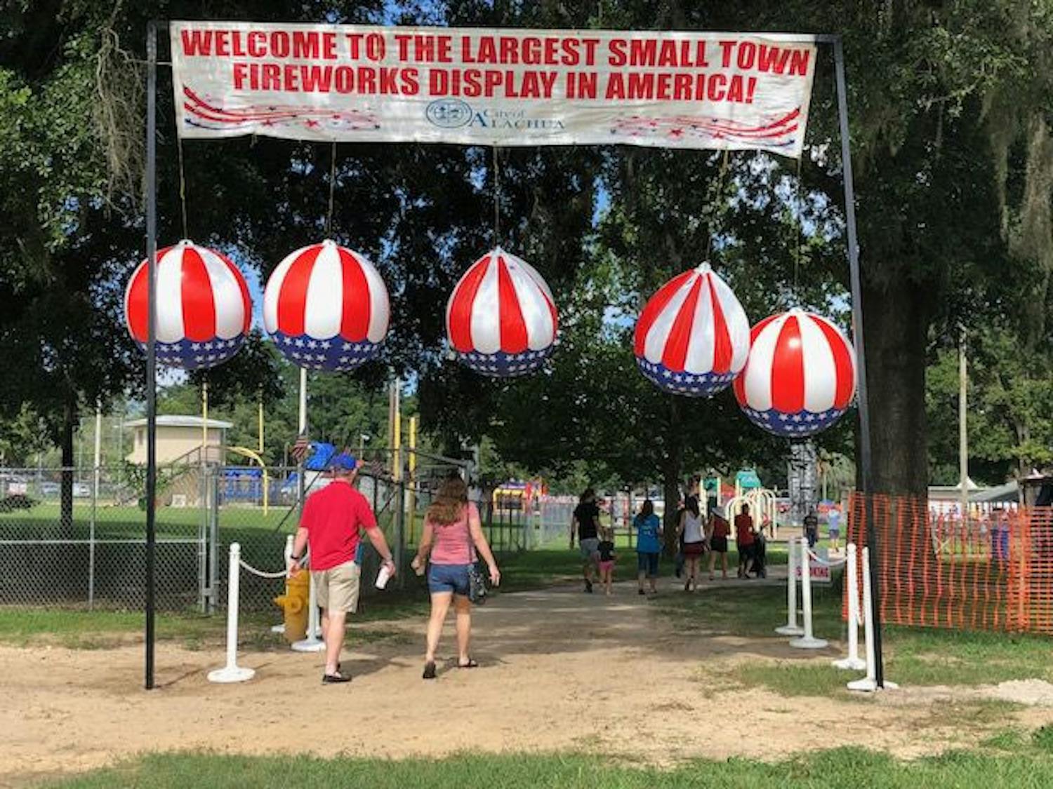 People file in through the main entrance to attend the festival.
