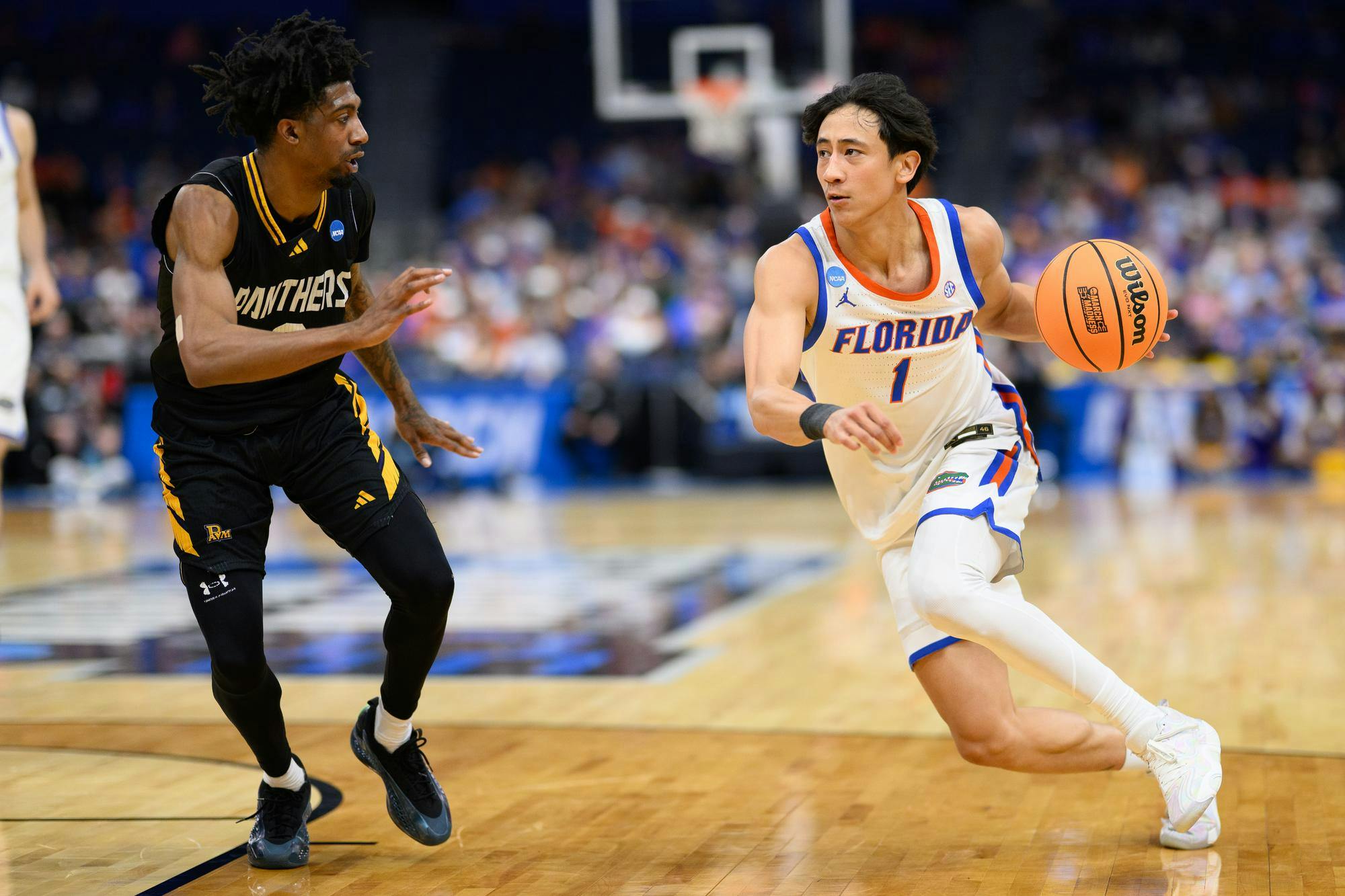 Florida guard Xaivian Lee (1) drives during the second half of an NCAA Tournament first round game against Prairie View A&M, Friday, March 20, 2026, in Tampa, Fla.