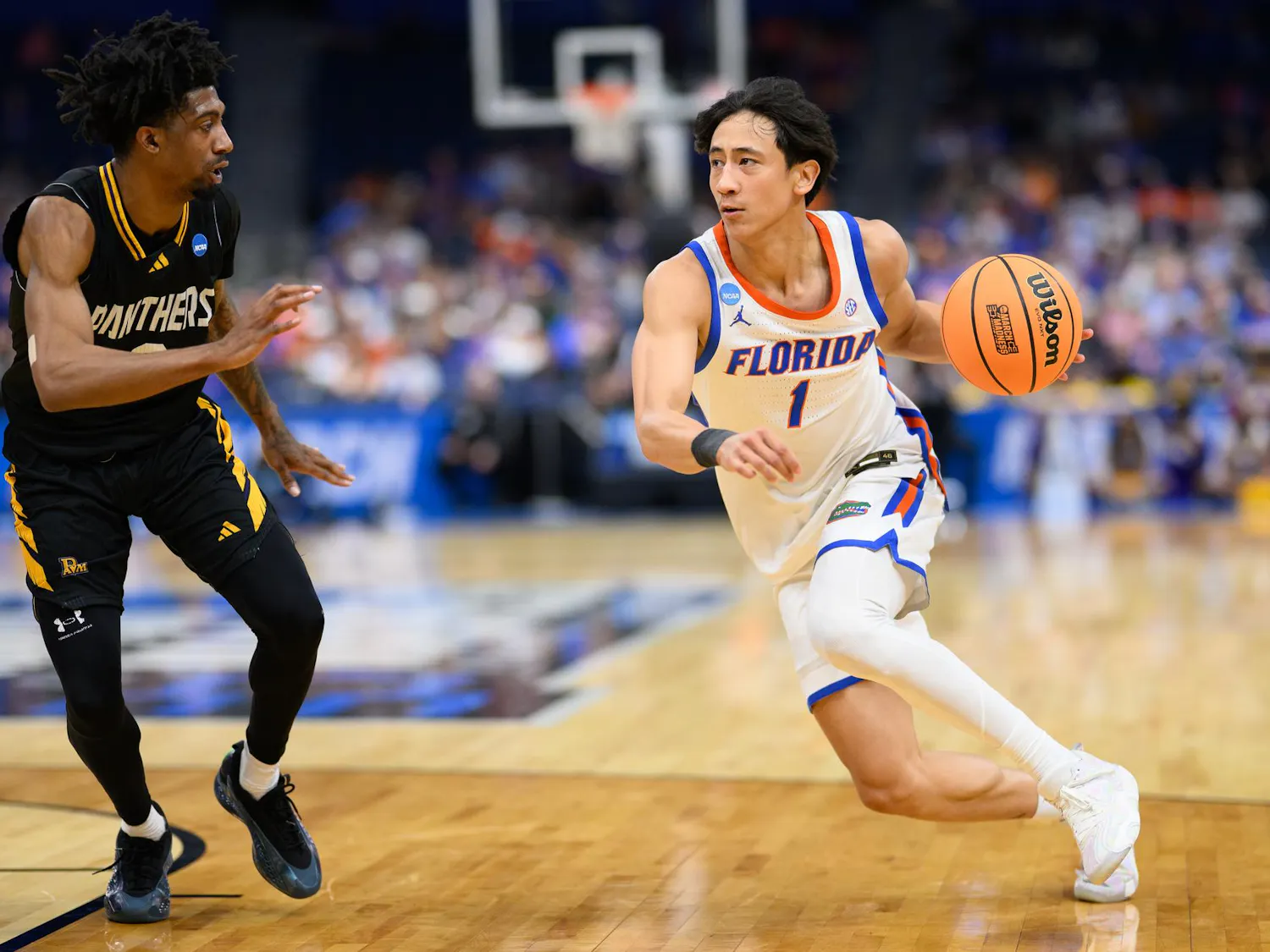 Florida guard Xaivian Lee (1) drives during the second half of an NCAA Tournament first round game against Prairie View A&M, Friday, March 20, 2026, in Tampa, Fla.