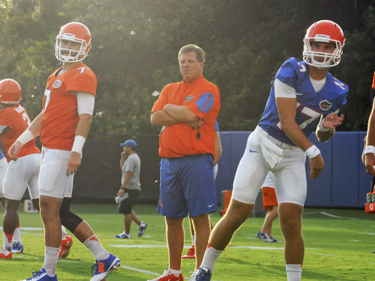 UF coach Jim McElwain (center) watches on as quarterbacks Will Grier (7) and Anderson Proctor (17) go through drills during practice on Aug. 31, 2015, at the Sanders Practice Field.