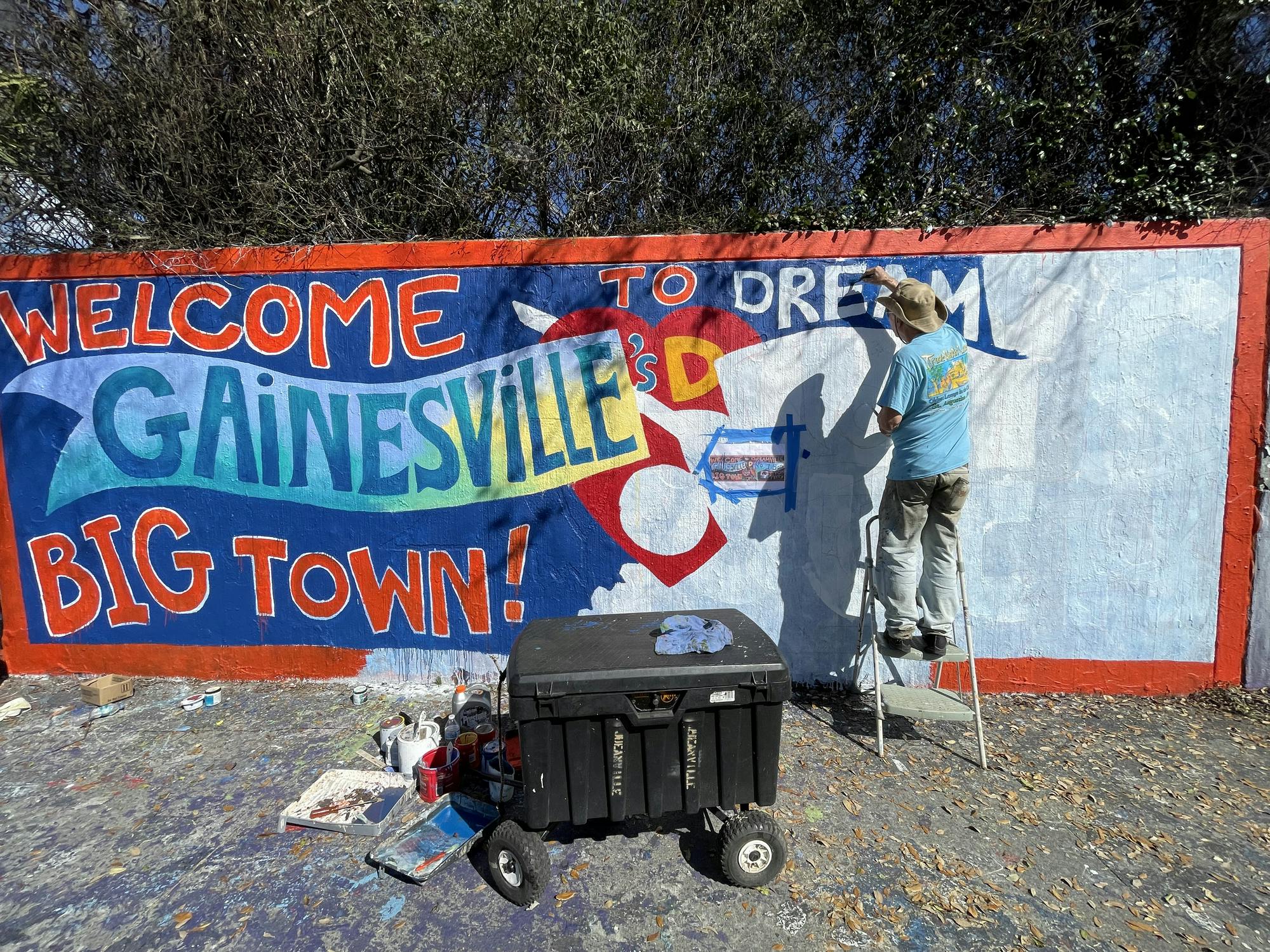 Harry D. Michael, a 72-year-old independent artist, carefully recreates a mural dedicated to Tom Petty at the 34th Street Wall in Gainesville, Fla. Monday, March 2, 2026.