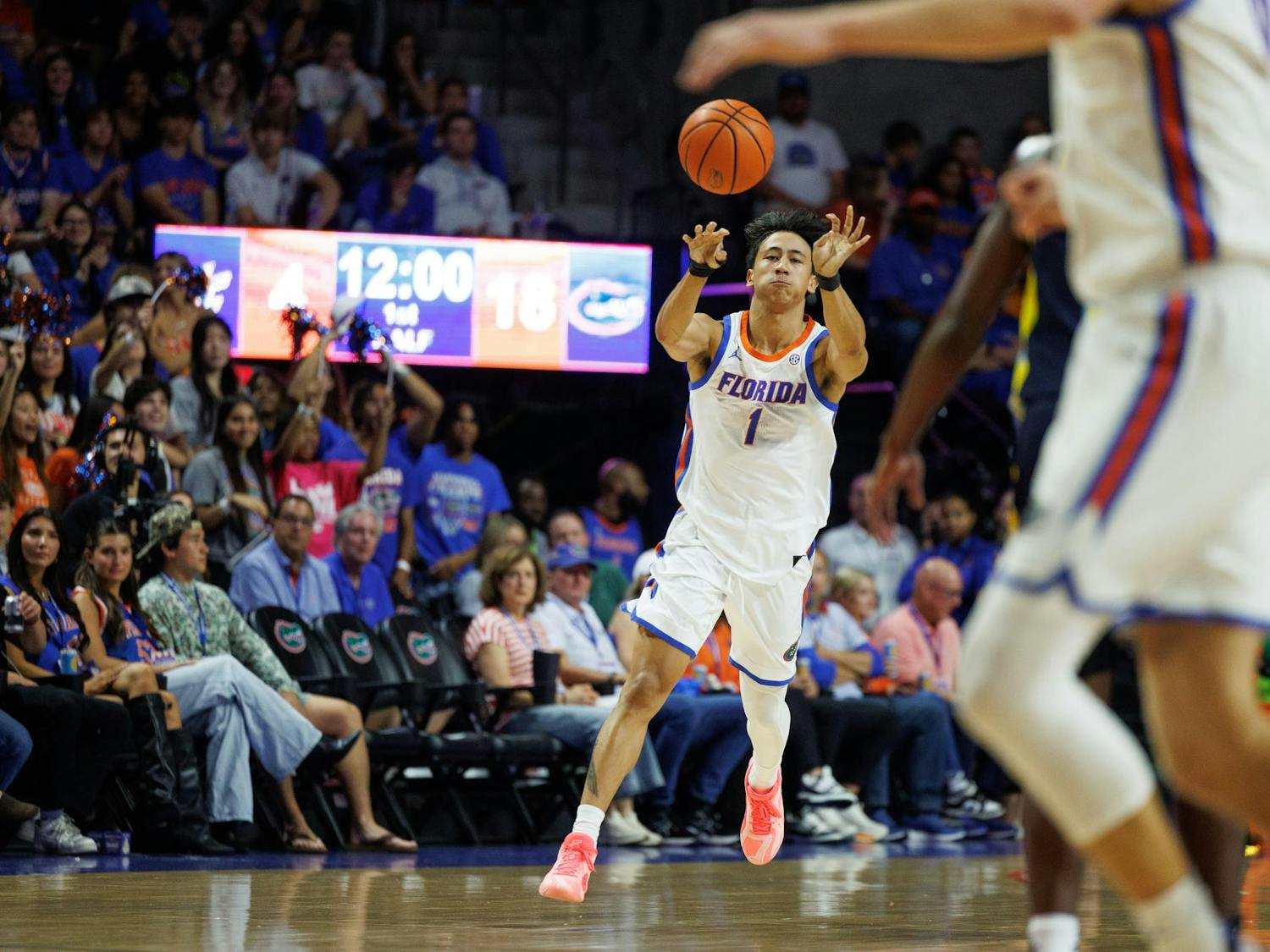Florida Gators guard Xaivian Lee (1) passes during the first half of a NCAA college basketball game against Merrimack, Friday, Nov. 21, 2025, in Gainesville, Fla.