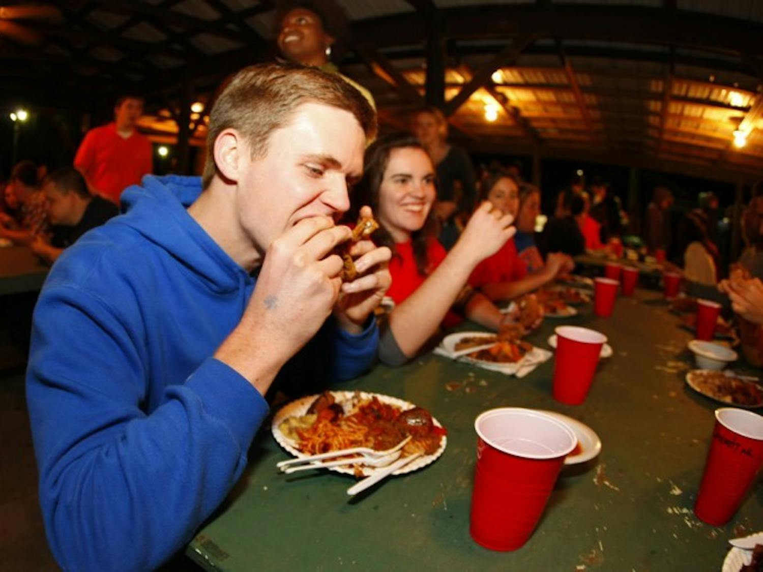 Civil engineering major Kyle Mays, 19, eats a piece of fried quail at the 29th annual Beast Feast on Saturday night. The event was sponsored by the UF Wildlife Society.