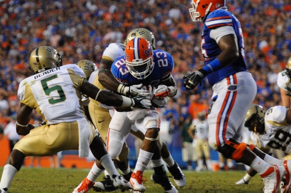 <p>Running back Mike Gillislee carries the ball in last year’s win against UAB on Sept. 10.</p>