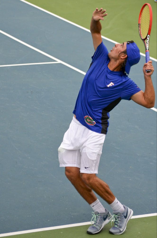 Diego Hidalgo prepares to serve during the SEC Fall Classic at UF's Ring Tennis Complex
