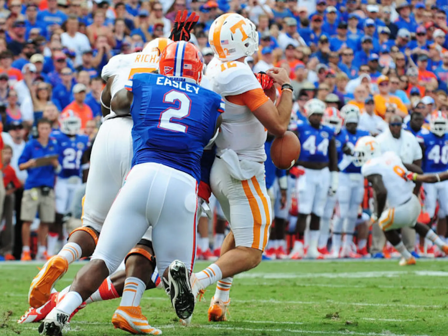 Dominique Easley forces a fumble during Florida’s 31-17 victory against Tennessee on Saturday in Ben Hill Griffin Stadium. Easley is out for the season after suffering tears to the ACL and meniscus in his right knee.