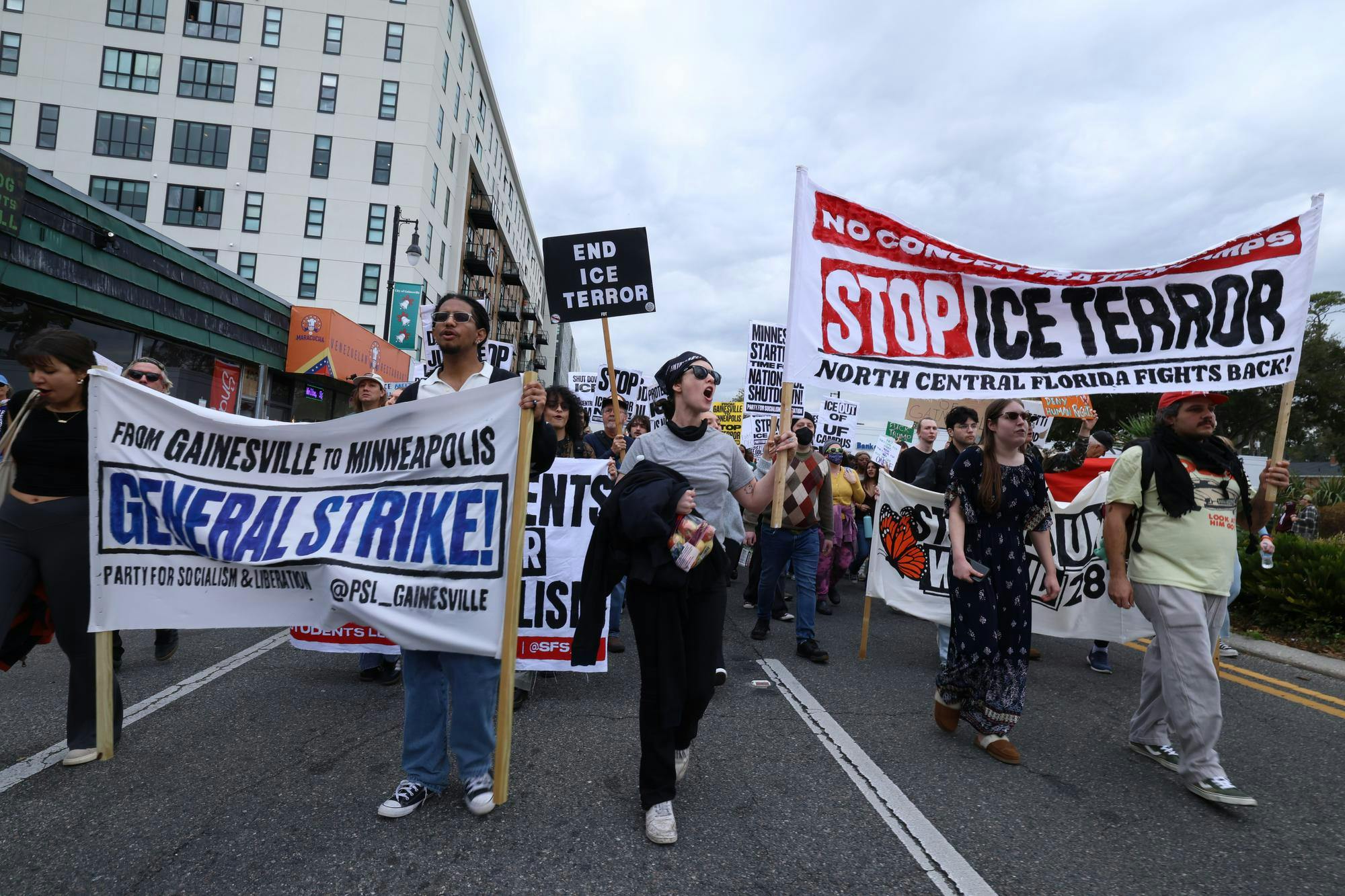 Protestors march down University Ave. during an anti-ICE protest in Gainesville, Fla., Friday, Jan. 30, 2026.