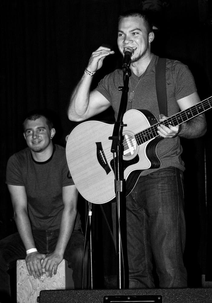Beat-boxer Rob Foldy (left) and guitarist Jon Lash perform Wednesday night at Common Grounds for a benefit concert hosted by the UF Chapter of Invisible Children.
